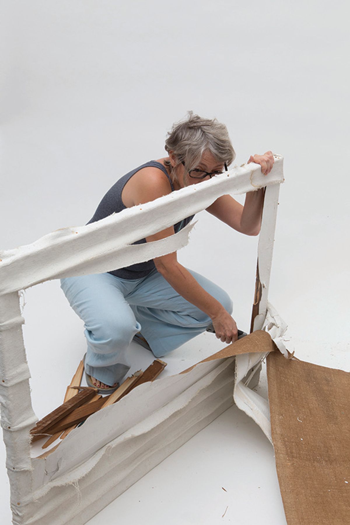 A representative of the Piero Manzoni Foundation destroys a work that it says is fake All rights reserved