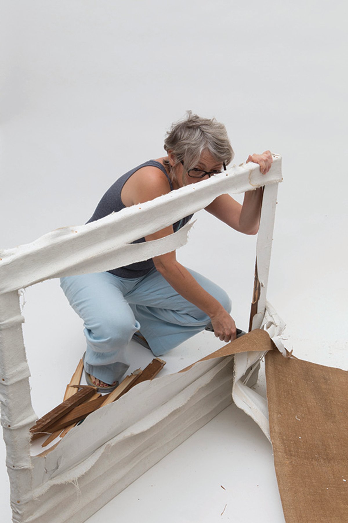 A representative of the Piero Manzoni Foundation destroys a work that it says is fake All rights reserved