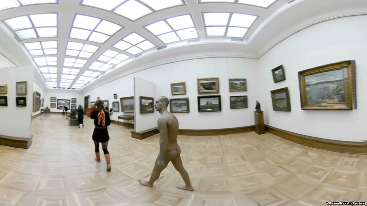 A naked man walks in Tretyakov Gallery in Moscow, Russia March 20, 2019 in a still image obtained from a social media video VK.COM/MAXTT via REUTERS