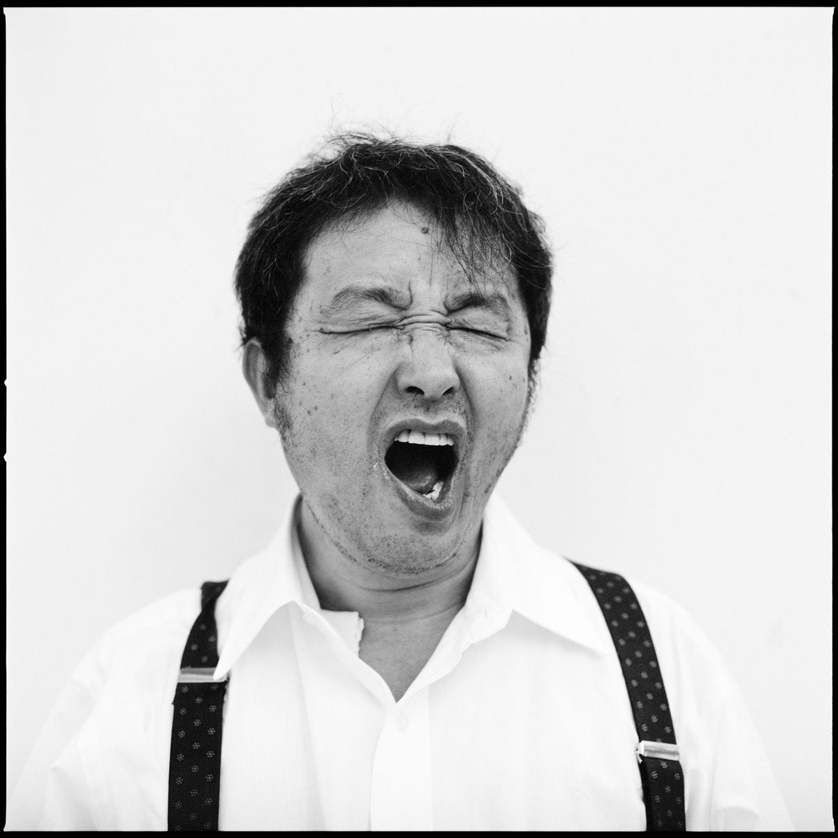 Nam June Paik yawning, photographed in 1993 by Roman Mensing © Roman Mensing, artdoc.de
