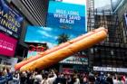 Meat me in Times Square: artists create giant 65ft-long hot dog sculpture for the New York plaza