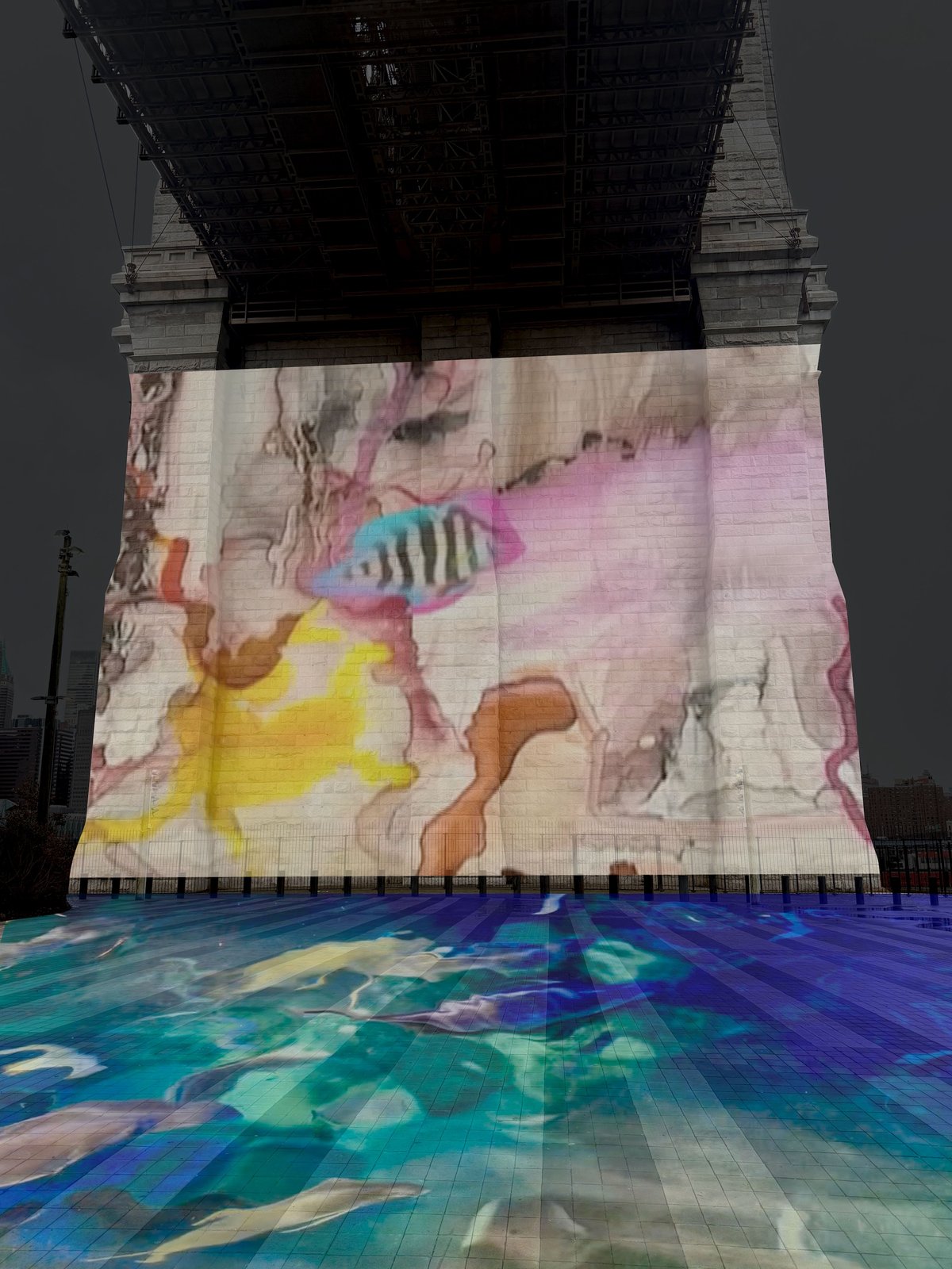 Rendering of Anita Glesta's AQUA COSMOS: The Hudson Canyon (2026) projected onto the Brooklyn Bridge Courtesy Anita Glesta