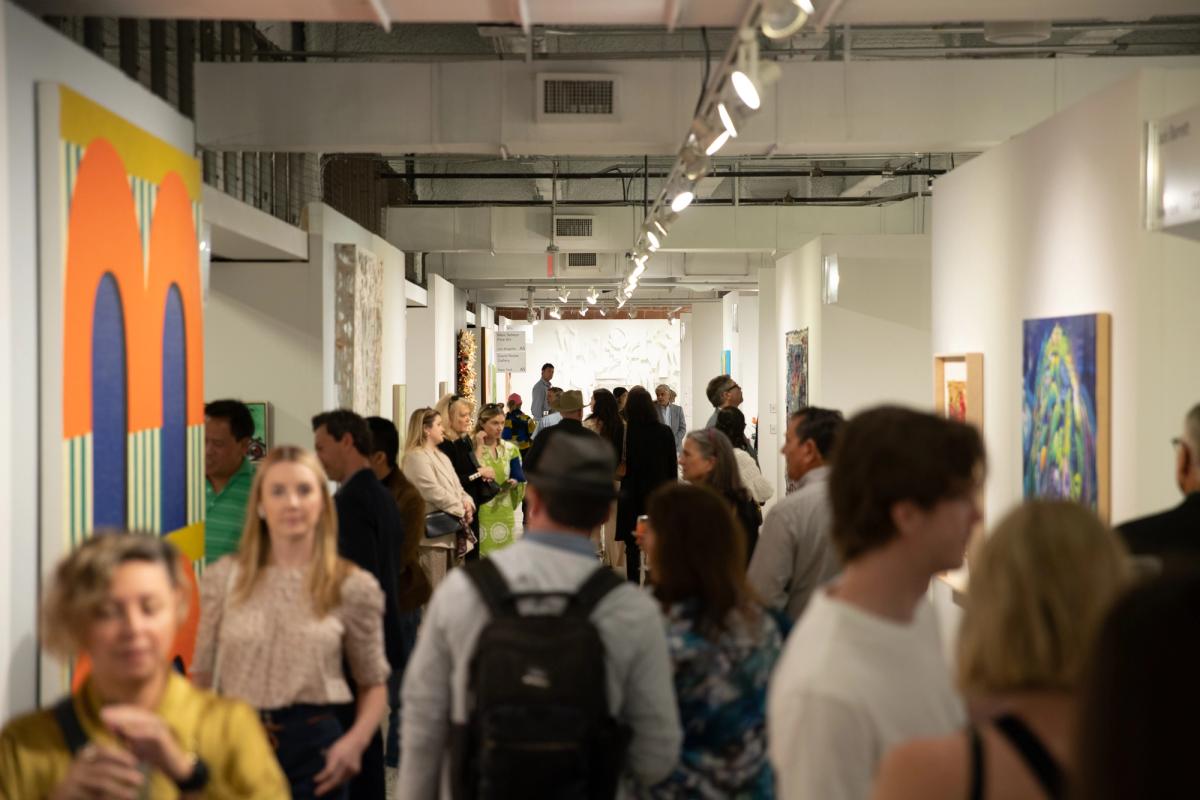 Attendees stream through the Fashion Industry Gallery at the VIP preview day of the Dallas Art Fair on Thursday (4 April). Exploredinary
