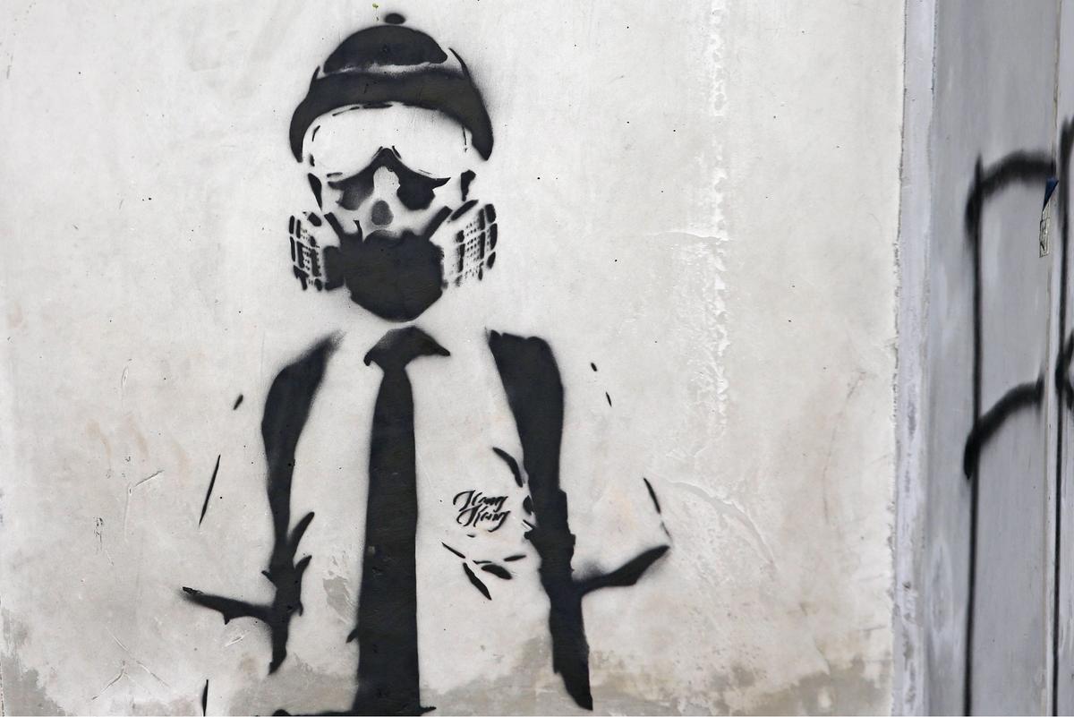 A graphic of protesters on a wall in Hong Kong on 20 October  as tension in the city escalated by inaction of the government response to the five demands of the protesters. James Lee/EYEPRESS/SIPA/Shutterstock