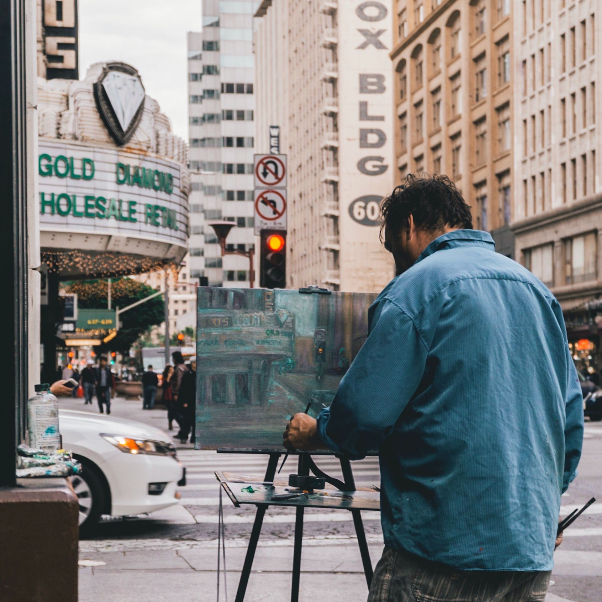 An artist paints on the streets of Los Angeles Photo by Brian Gordillo on Unsplash