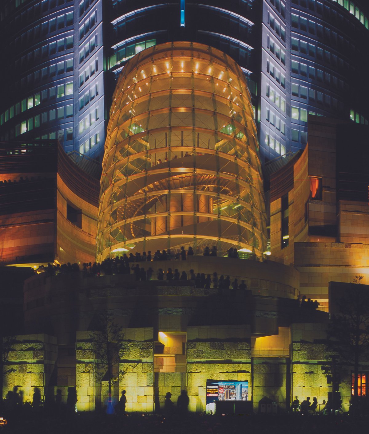 The “cone” that marks the entrance to the Mori Art Museum in Tokyo becomes a luminous beacon at night. The museum itself is on the 53rd floor of the skyscraper Image: Courtesy of Mori Art Museum