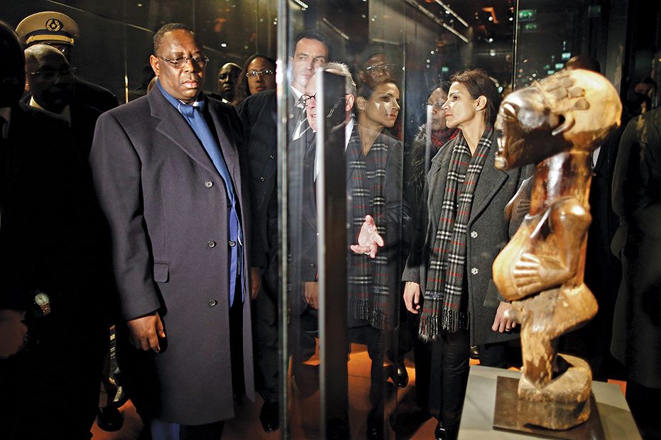 The Senegalese president, Macky Sall, at the Musée du Quai Branly-Jacques Chirac museum in 2016. The country has said it wants the return of all objects from Senegal in French museums © Charles Platiau/AFP/Getty Images