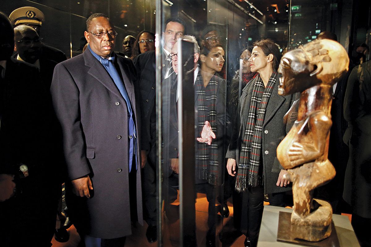 The Senegalese president, Macky Sall, at the Musée du Quai Branly-Jacques Chirac museum in 2016. The country has said it wants the return of all objects from Senegal in French museums © Charles Platiau/AFP/Getty Images