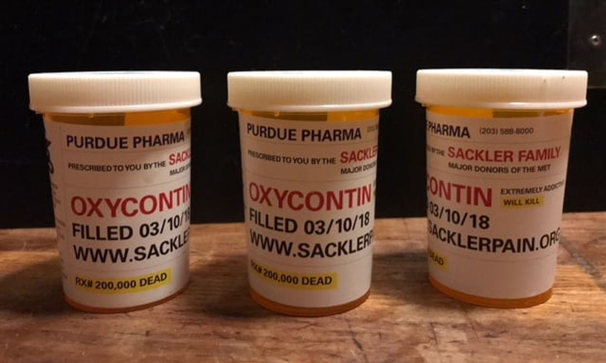 Fake pill bottles labelled as OxyContin and "Rx# 200,000 dead" used by the protestors Photo: Nan Goldin