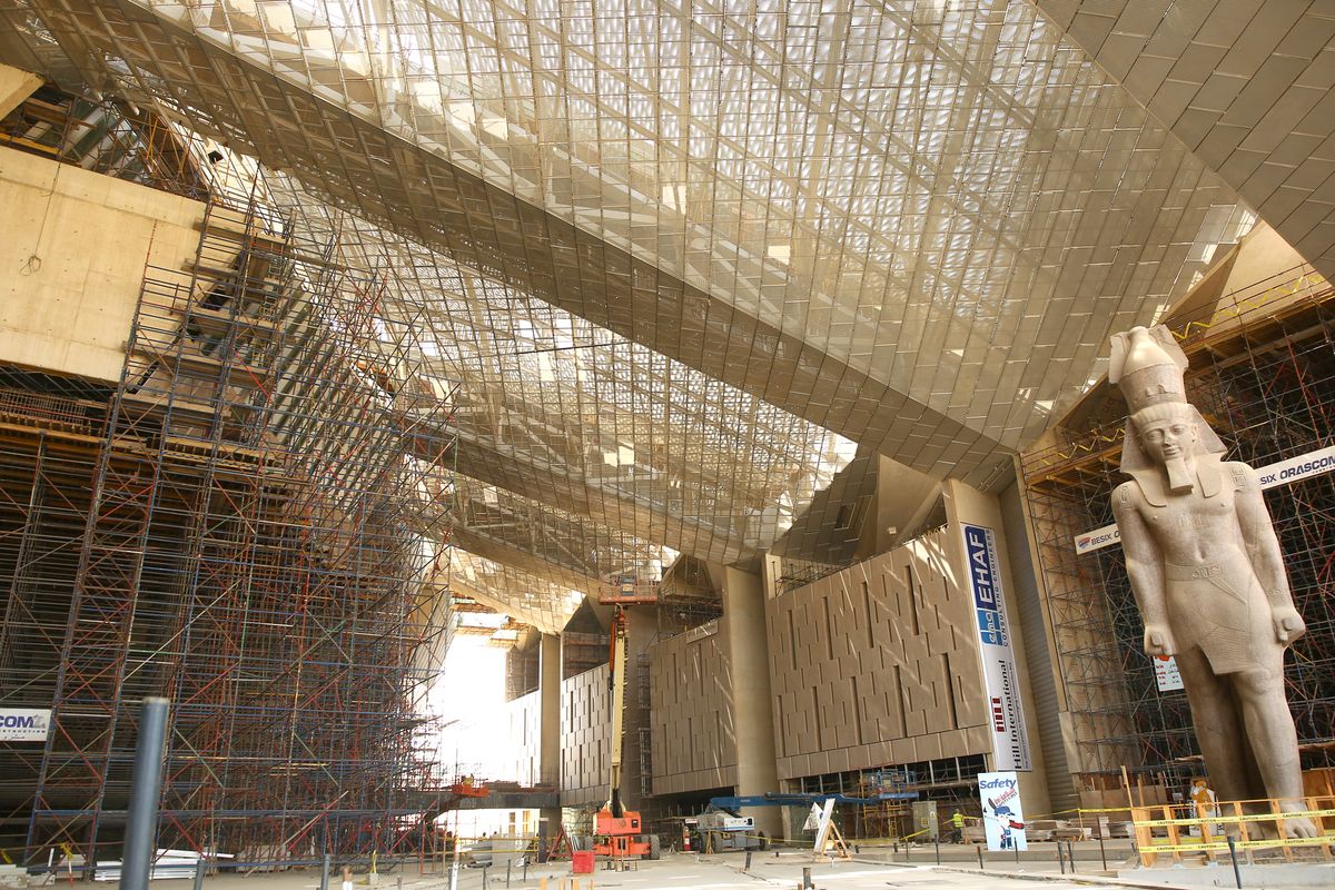 The soaring entrance hall of the Grand Egyptian Museum, where a 12m-tall, 83-ton granite statue of King Ramses II is already in place 