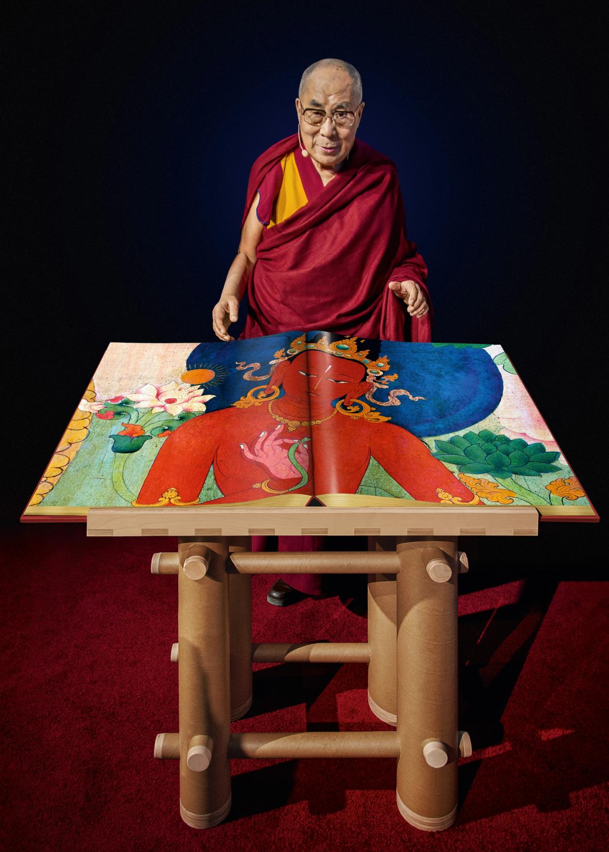 Tenzin Gyatso, the Fourteenth Dalai Lama, with a draft copy of Murals of Tibet Photo: Mina Magda © TASCHEN