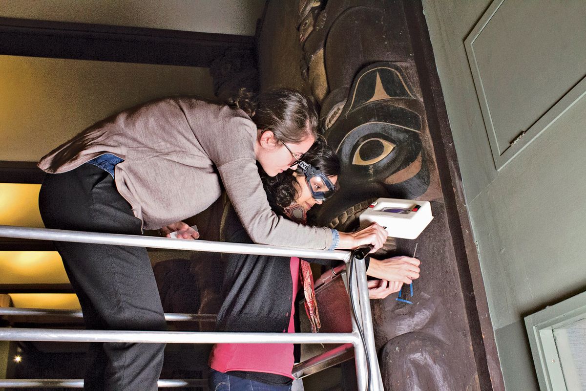 Federica Pozzi and Anna Cesaratto remove samples from a Tsimshian house post Courtesy of the Metropolitan Museum of Art