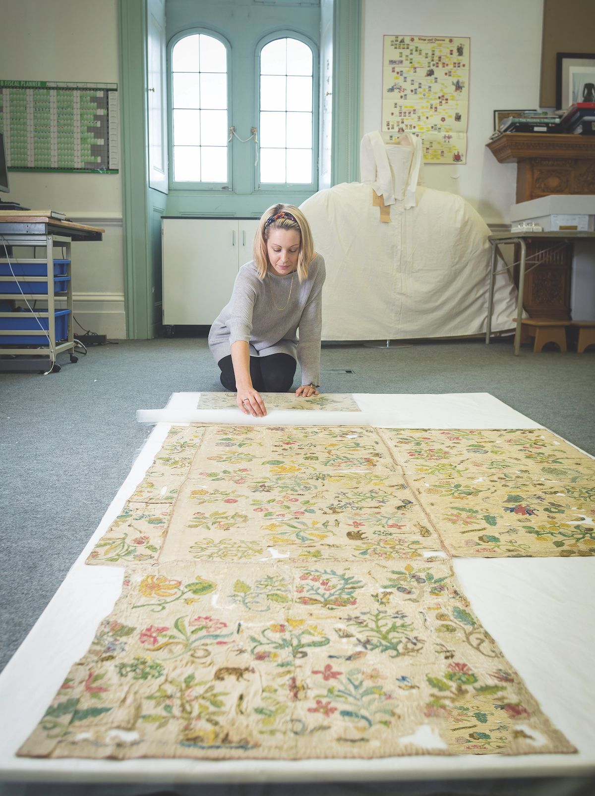 Conservator Elizabeth Thompson works on the altar cloth © Historic Royal Palaces/Richard Lea Hair; courtesy of St Faith's Church, Bacton