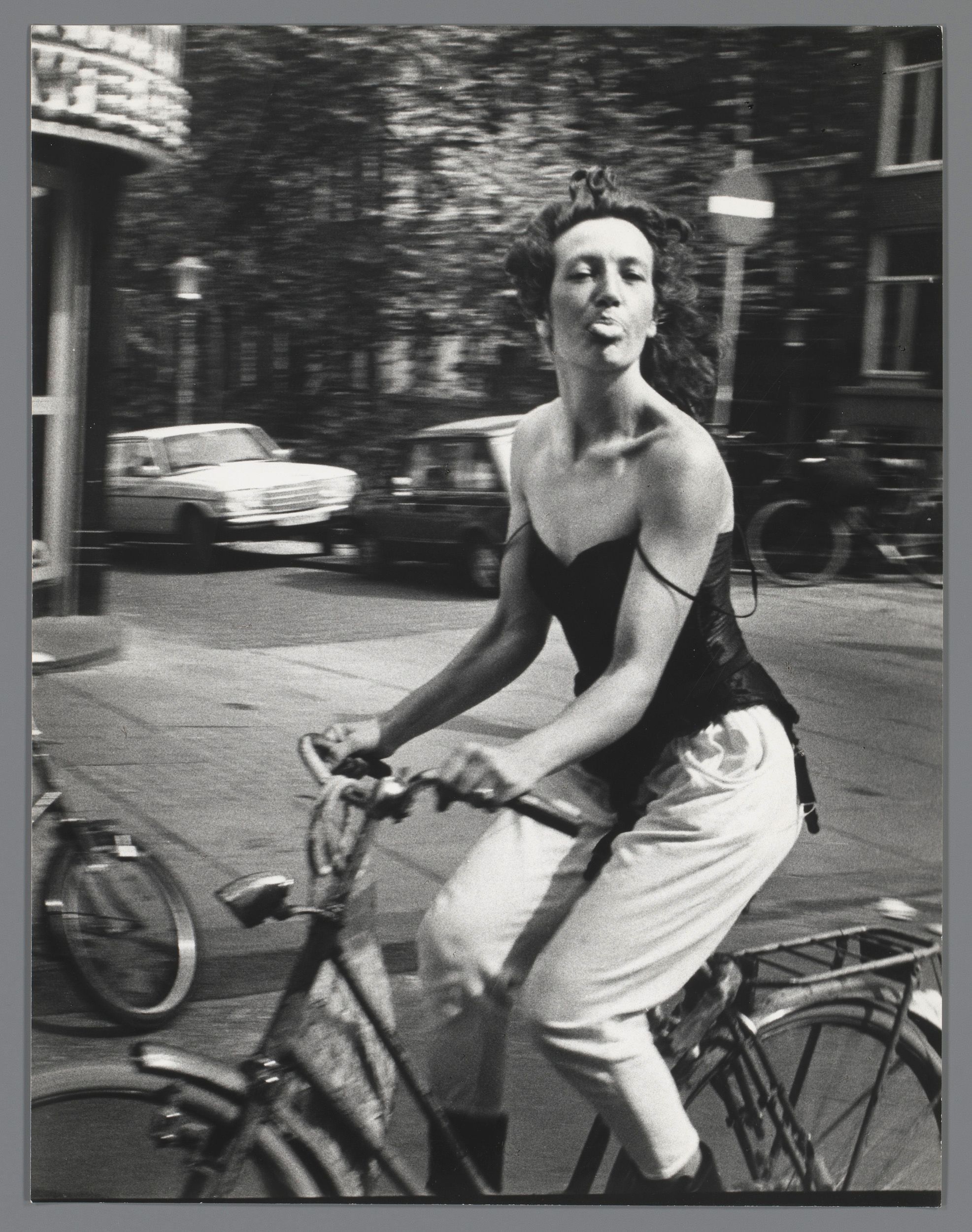 Woman on a Bicycle (1983), taken in Amsterdam by the Dutch photographer Ed van der Elsken © Ed van der Elsken estate/Nederlands Fotomuseum; courtesy Rijksmuseum