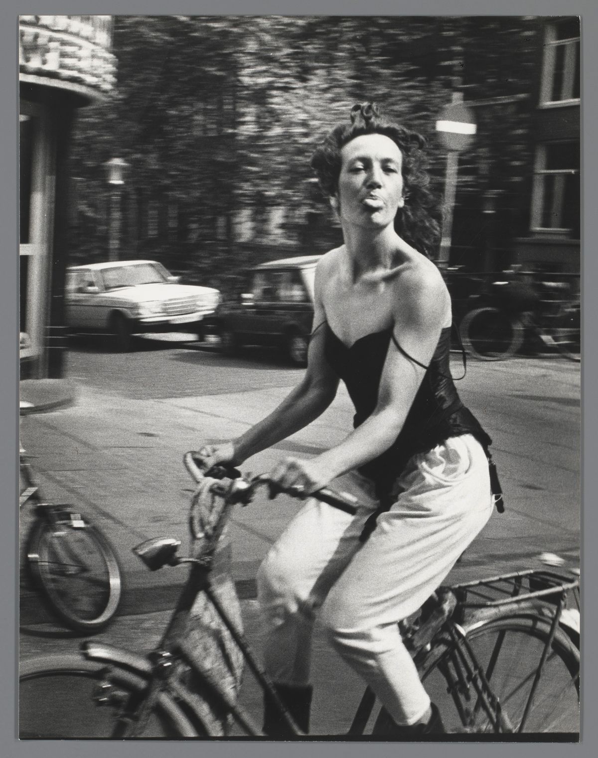 Woman on a Bicycle (1983), taken in Amsterdam by the Dutch photographer Ed van der Elsken © Ed van der Elsken estate/Nederlands Fotomuseum; courtesy Rijksmuseum