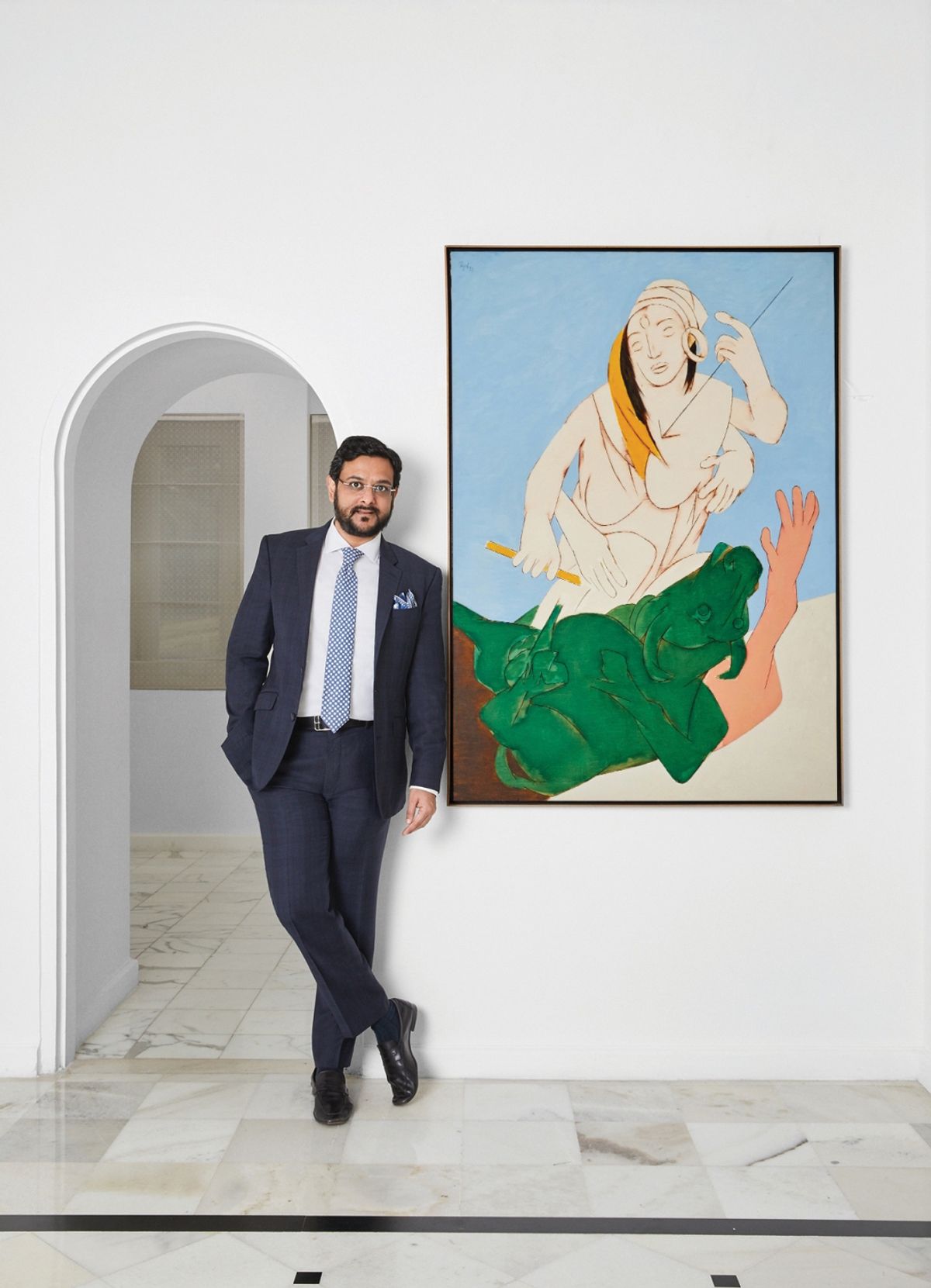 Gaurav Bhatia, the managing director of Sotheby's India, with Tyeb Mehta's Durga Mahisasura Mardini Photo: IANS