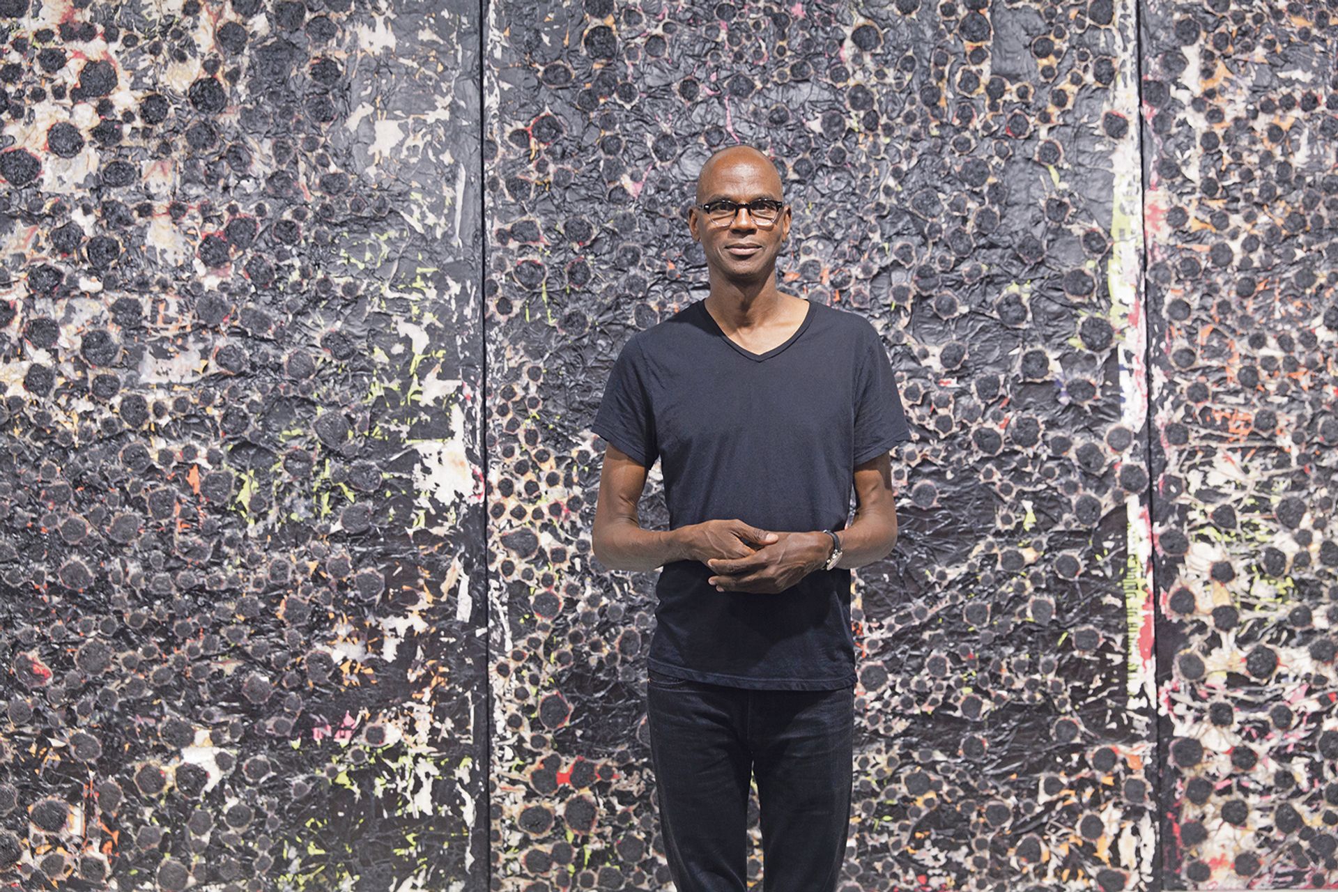 The Los Angeles artist Mark Bradford in front of his work at Hauser & Wirth's stand at Art Basel in Miami Beach Photo: © Vanessa Ruiz
