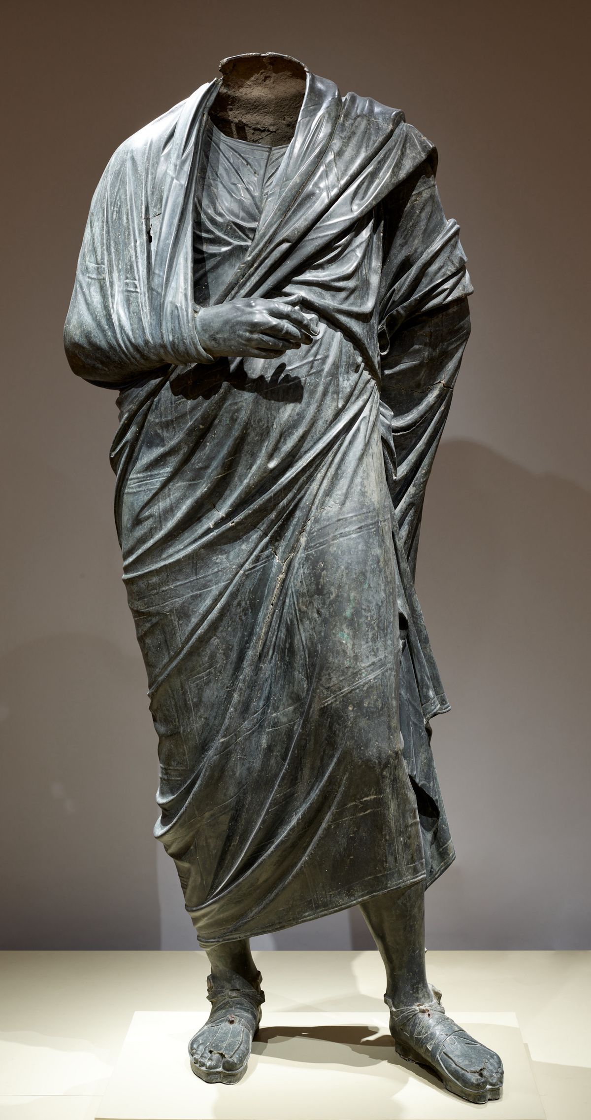 This bronze statue was formerly described by the Cleveland Museum of Art as likely depicting Roman emperor Marcus Aurelius as a philosopher. Now it is described as Draped Male Figure, around 150BCE-200CE. Roman or possibly Greek Hellenistic. The Cleveland Museum of Art