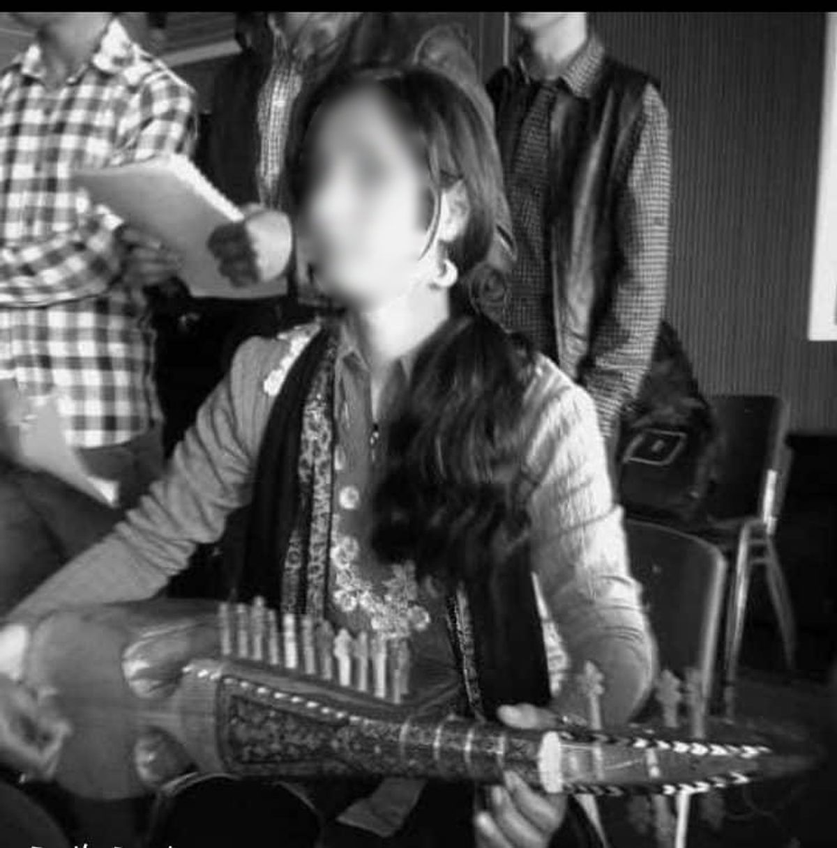 Sima is separated from her music and housebound, with nothing to do but to stare at the walls and worry whether the Taliban will find her