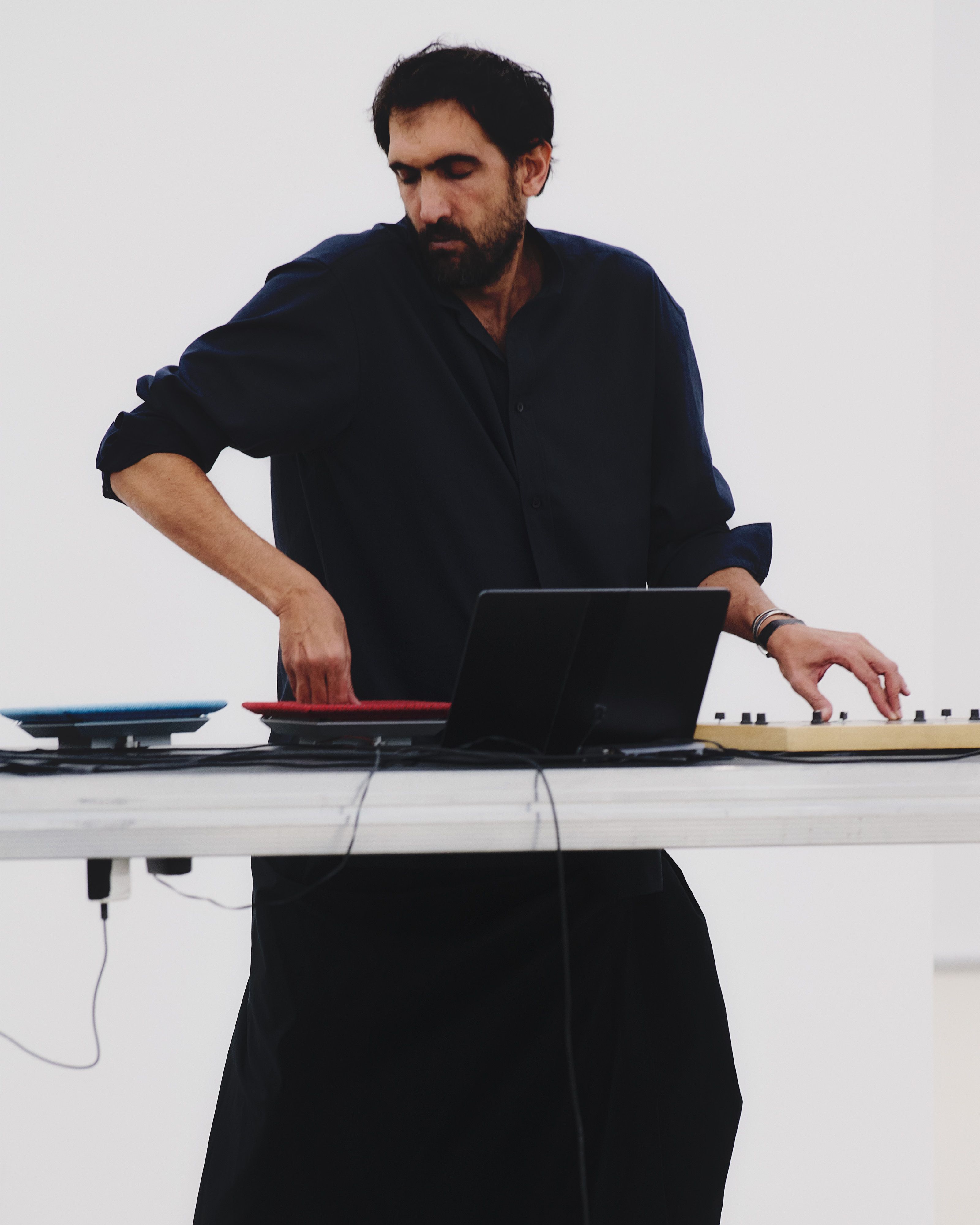Tarek Atoui performing at the Issey Miyake Spring-Summer 2026 presentation at Centre Pompidou, Paris, in October 2025 Photo: © Luna Conte
