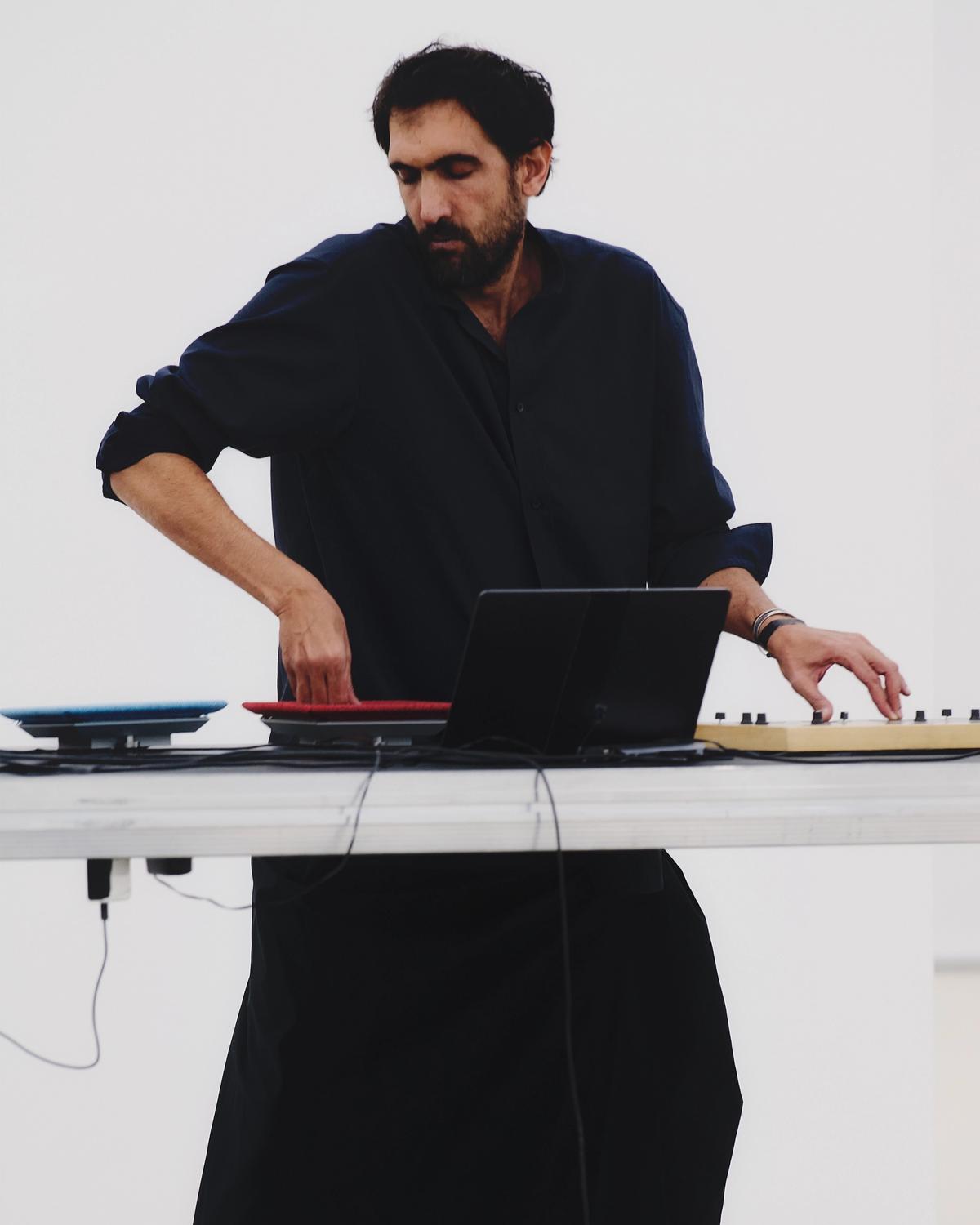 Tarek Atoui performing at the Issey Miyake Spring-Summer 2026 presentation at Centre Pompidou, Paris, in October 2025 Photo: © Luna Conte