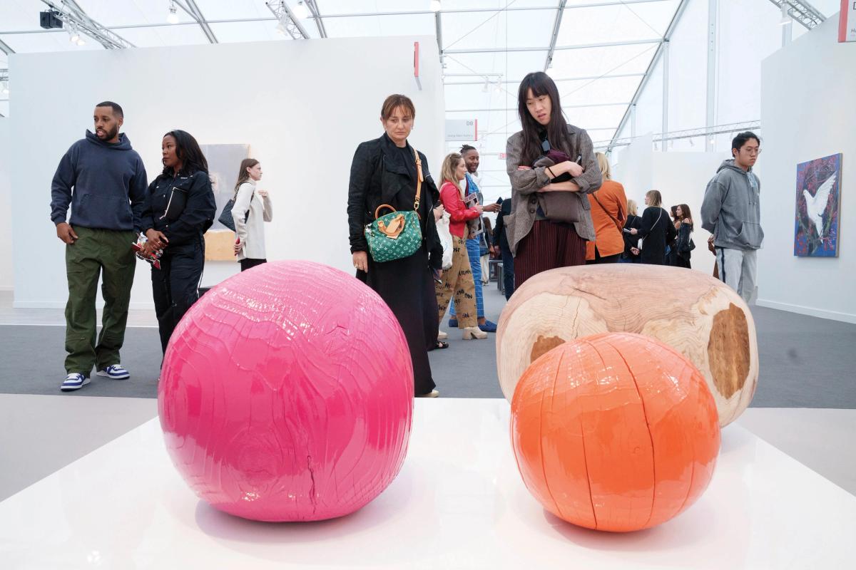 Lumber of love: visitors size up Jesse Schlesinger works on the Anthony Meier stand Eric Thayer