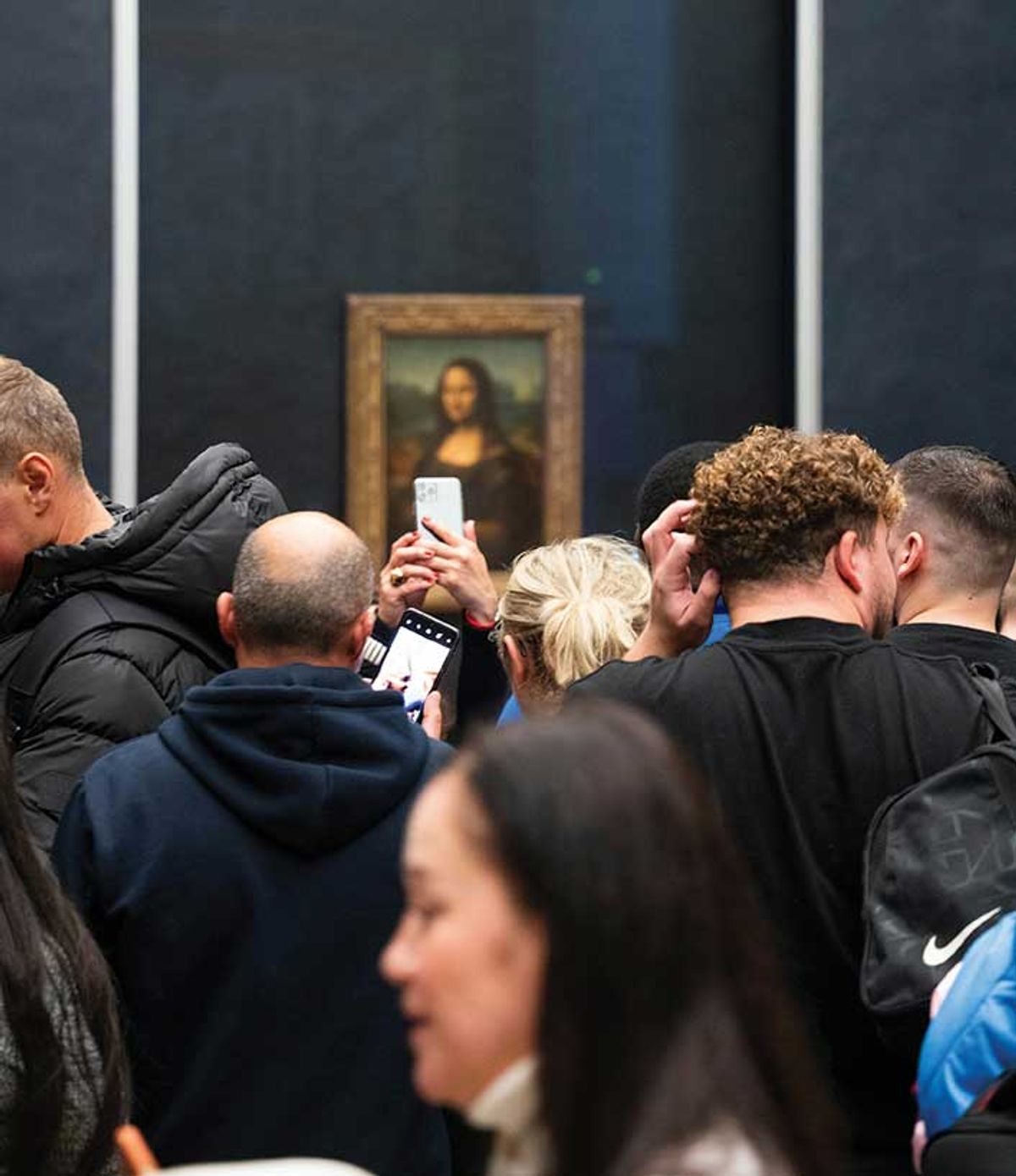 Standing room only: 20,000 visitors a day flood the gallery where the Mona Lisa is crammed in with other works
Photo: David Emrich
