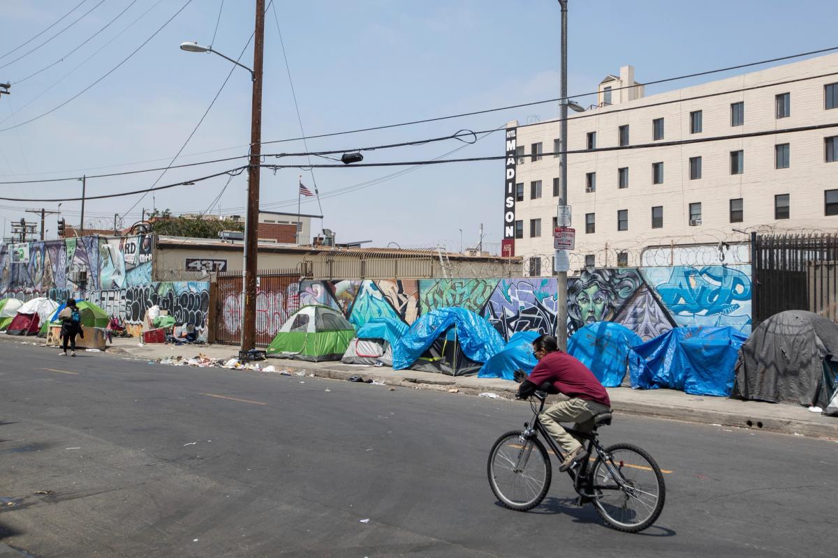 A community of homeless people living in tents line a Skid Row street in Downtown Los Angeles Jeff Lewis/AP Images for AIDS Healthcare Foundation
