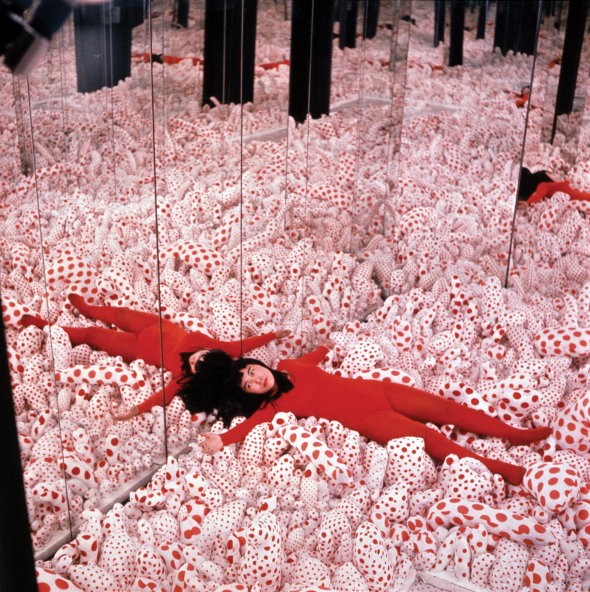Yayoi Kusama in her breakthrough Infinity Mirror Room Phalli’s Field at the Castellane Gallery in New York in 1965 © Yayoi Kusama; Courtesy of Ota Fine Arts, Victoria Miro and David Zwirner; Photo: Eikoh Hosoe