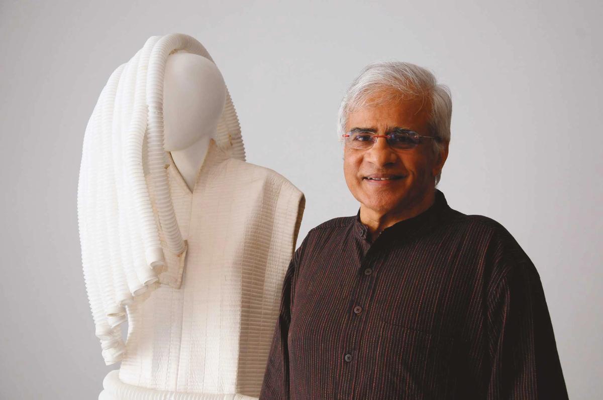 Sundaram with Angel-wing (2010) from his series Gagawaka, a set of 27 sculptural garments made from recycled materials and medical supplies
Photo: Dilip Thakkar. Courtesy Chemould Prescott Road