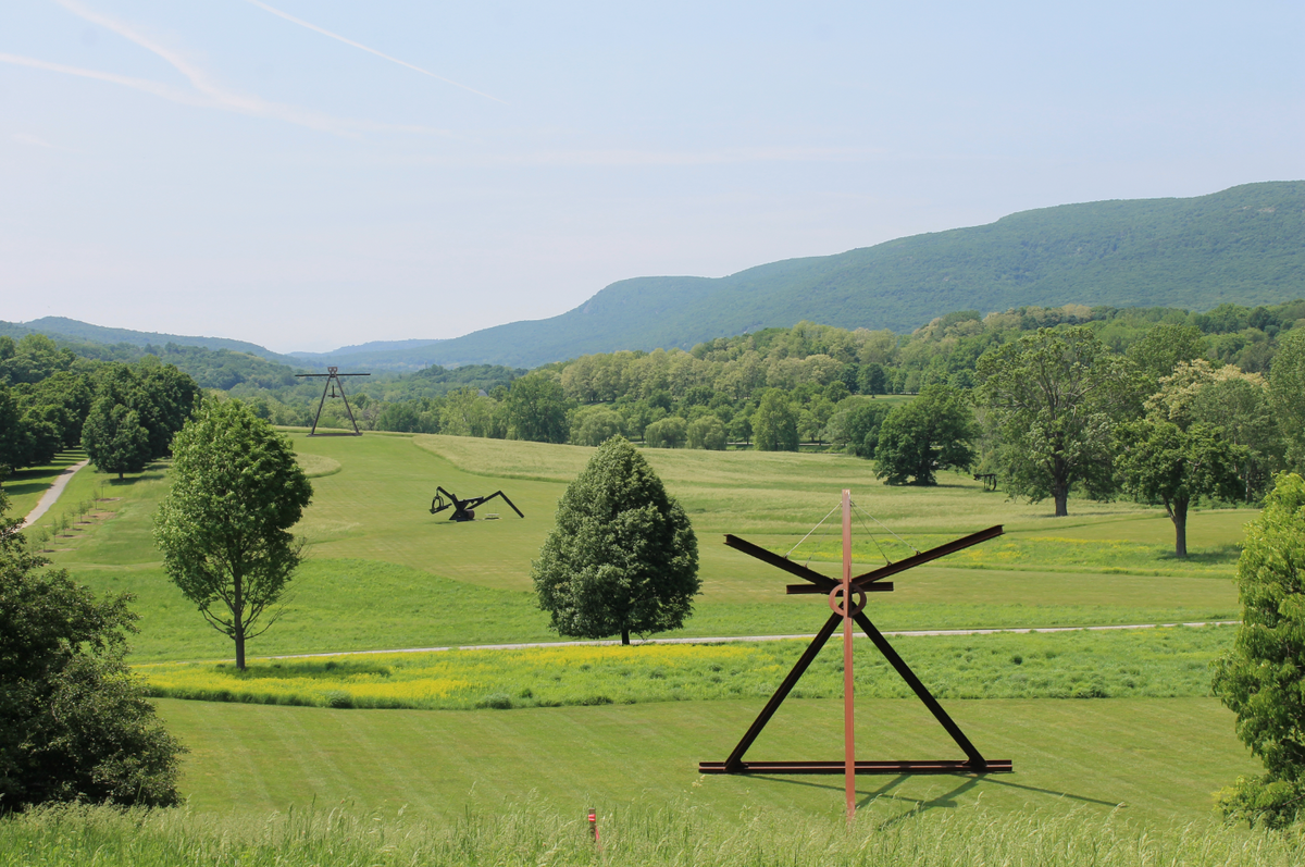 View of the South Fields, all works by Mark di Suvero. From left to right: Pyramidian (1987/1998). She (1977-1978). Mon Père, Mon Père (1973-75). Mother Peace (1969-70). © Mark di Suvero, courtesy the artist and Spacetime C.C., NY. Photo: Storm KingArt Center ©2020.