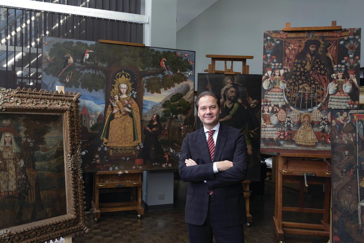 The Met's director Max Hollein with paintings from the James Kung Wei Li gift, including Our Lady of Mercy, called The Pilgrim of Quito (around 1720-30, far left in the frame) Our Lady of Valvanera (around 1770-80, large painting second from left) and Saint Christopher (around 1710-20, behind Hollein) Credit: The Metropolitan Museum of Art, New York