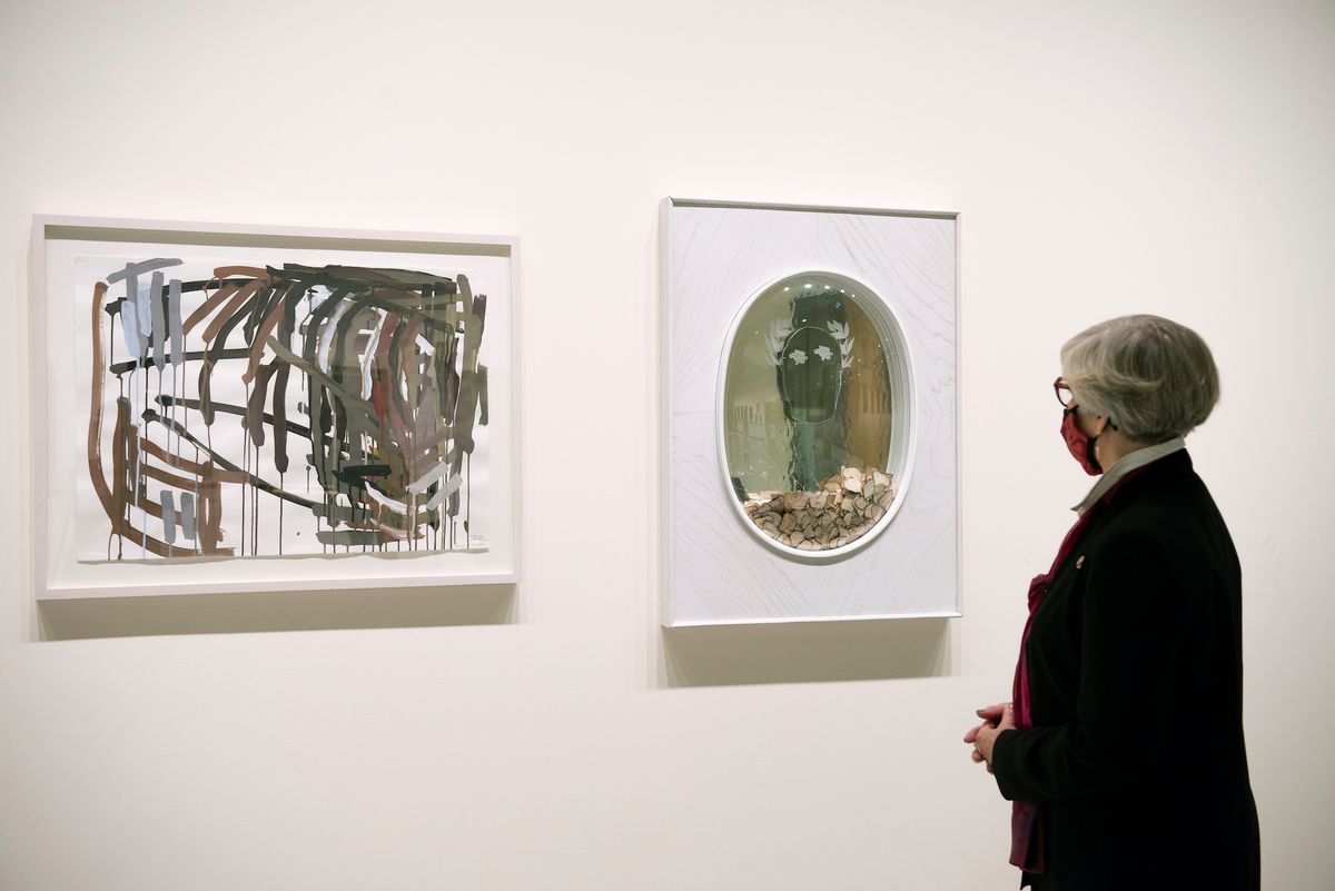 Senator Patricia Bovey admires Wyoming Saddle (2000) by Denyse Thomasos, left, and Light Laureate (2019-20) by Tim Whiten, which she arranged to have exhibited in the foyer of the Senate of Canada Building Courtesy and © the Senate of Canada