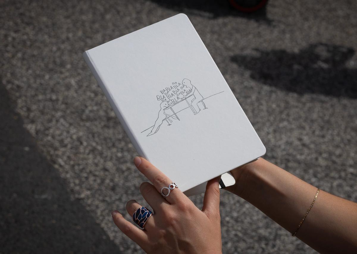 Hurry! Hurry! UBS is giving away notebooks by Olaf Bruening © 2026 Peter Macdiarmid for UBS