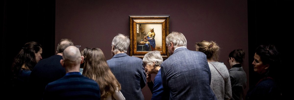 Visitors at the Amsterdam museum crowd around one of the artist’s most famous works, The Milkmaid (1658-59). It was one of the 28 works assembled for the show that made it the largest-ever Vermeer exhibition
ANP/Alamy Stock Photo