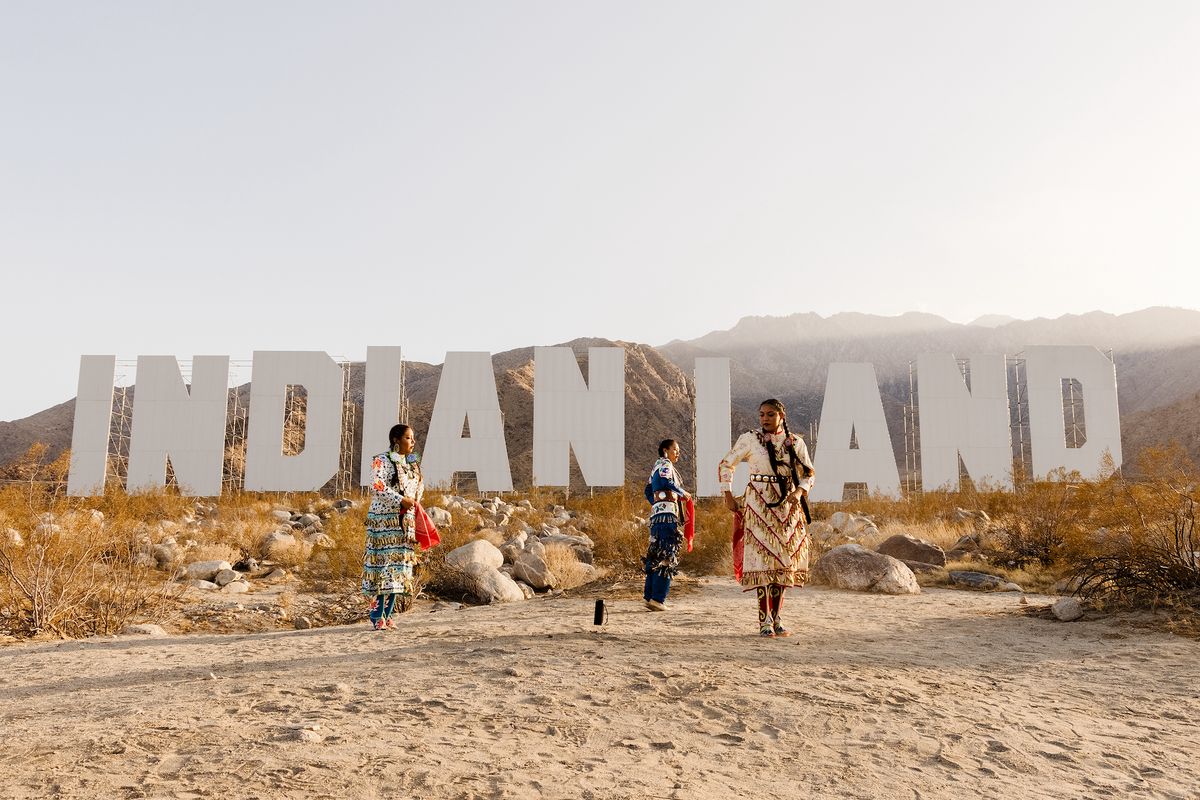 A performance at Nicholas Galanin's Never Forget (2021) at Desert X 2021. Photography by Lance Gerber, courtesy the artist and Desert X. LANDBACK GoFundMe