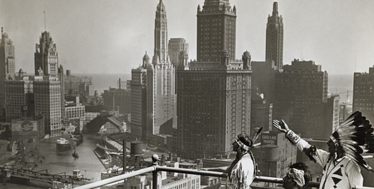 Princess O-Me-Me, a Chippewa, Sun Road, a Pueblo, and Chief Whirling Thunder, a Winnebago, look over Chicago's skyline from the roof of the Hotel Sherman  03 October, 1929 Photo: Underwood & Underwood/CORBIS/Corbis via Getty Images
