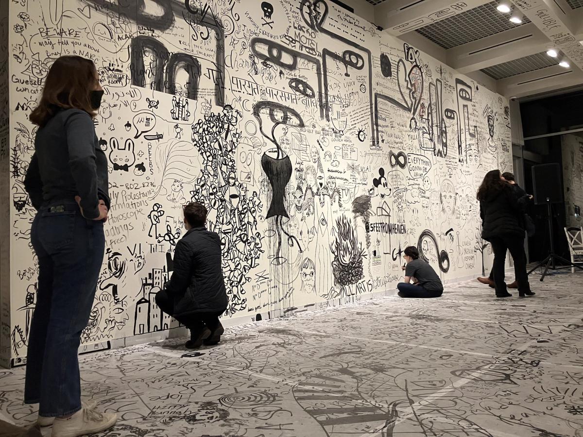 Visitors drawing on the walls and floor in THE OPEN MUSEUM at the Elizabeth Myers Mitchell Museum at St. John's College SJC Communications Department