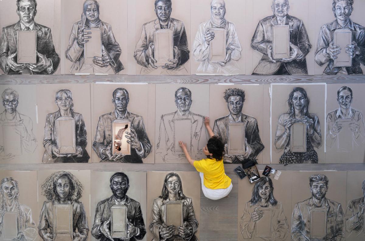 Devlin’s large-scale chalk and charcoal portraits depict Londoners who have “experienced forced displacement from their homelands”
Daniel Devlin