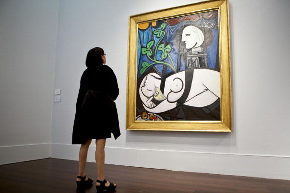 A visitor looks at Nude, Green Leaves and Bust by Pablo Picasso, during a preview at Christie's New York in 2010. The piece could fetch $100m Photo: Ramin Talaie/Bloomberg via Getty Images
