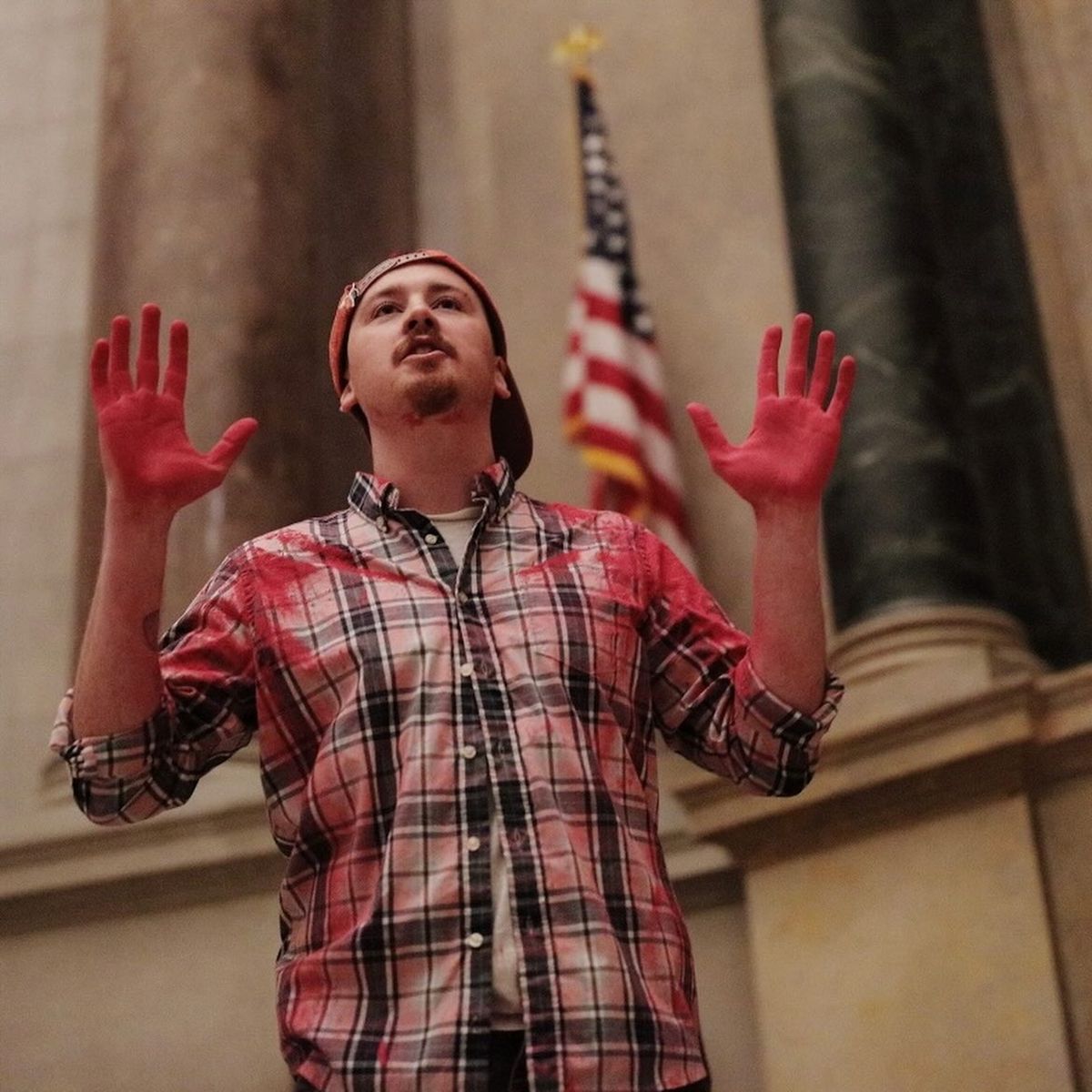 A Declare Emergency activist during the 14 February protest at the National Archives in Washington, DC Declare Emergency/Facebook