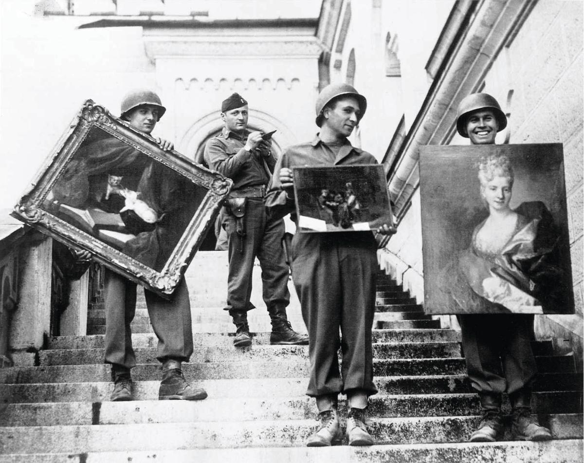 Four American soldiers, including Captain James Rorimer (centre left), stand on the steps of Germany's Neuschwanstein Castle in 1945. They were part of the the US army's Monuments, Fine Arts and Archives Section, which helped to recover stolen cultural property during the Second World War. Members of the section  became known as the Monuments Men. Rorimer, meanwhile, went on to serve as the director of the Metropolitan Museum of Art in New York

NARA / Public Domain