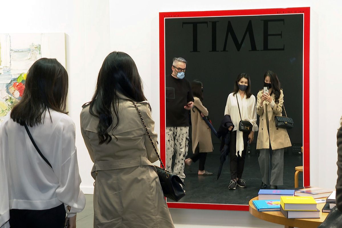 A survey by the Art Dealers Association of America found most galleries plan on reducing participation in both virtual and in-person art fairs. Above: visitors reflect on the return of the in-person art fair during Frieze New York. AP Photo/Ted Shaffrey