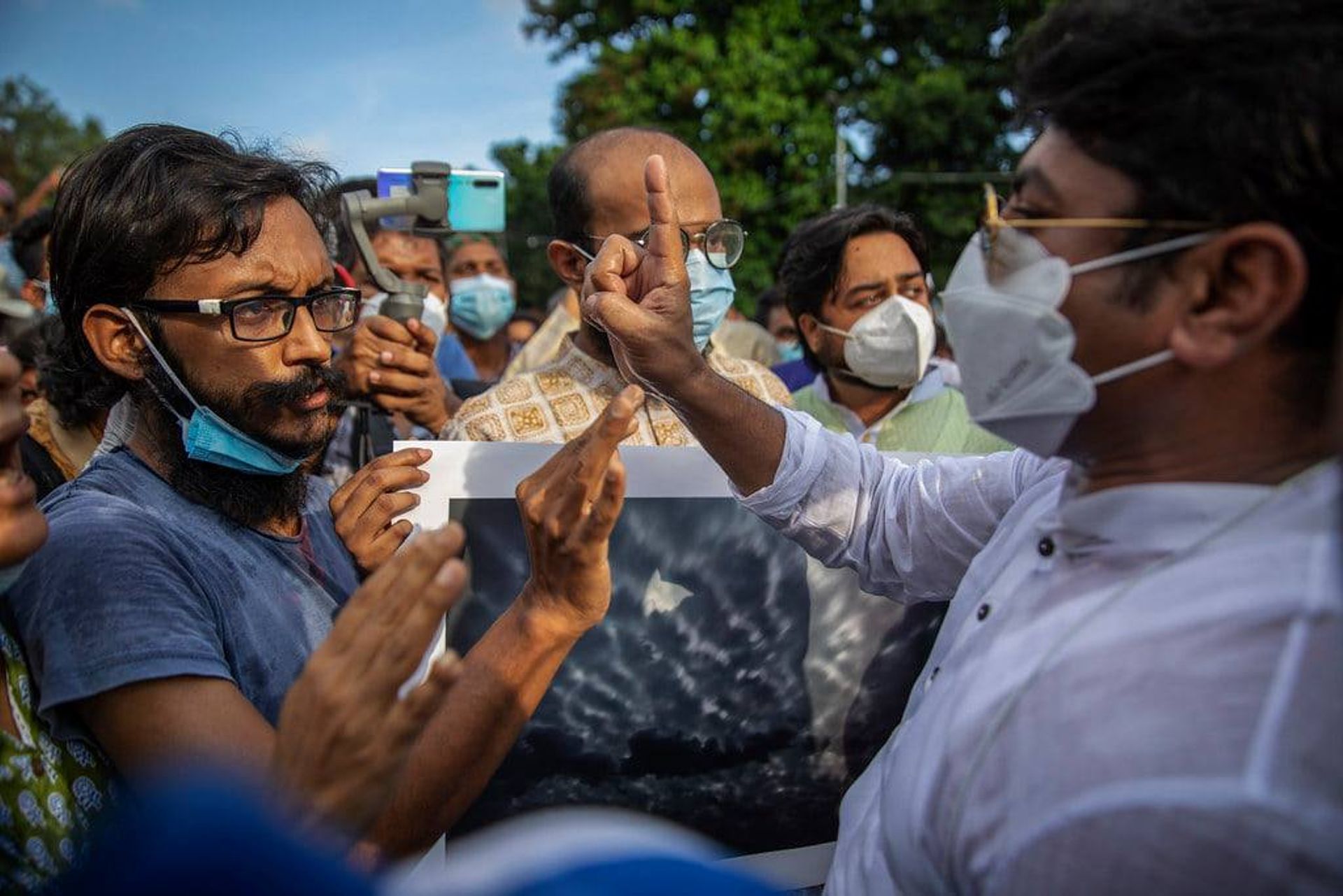 Dhaka city councillor Hasibur Rahman Manik (right), in an altercation with Uddin Ahmed (left), the co-director of a protest performance which took place in Dhaka University on 4 September. © Habibul Haque / Drik