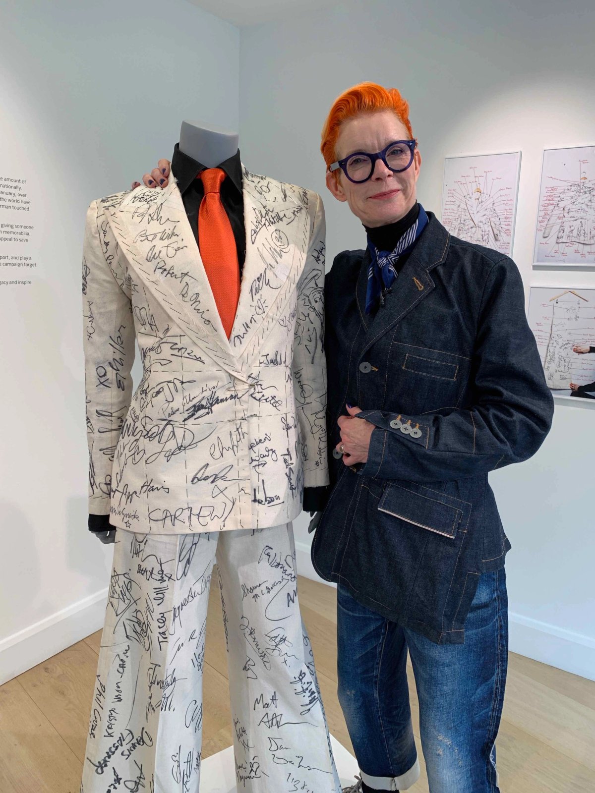 Sandy Powell at Phillips with the suit signed by numerous celebrities courtesy Gareth Harris