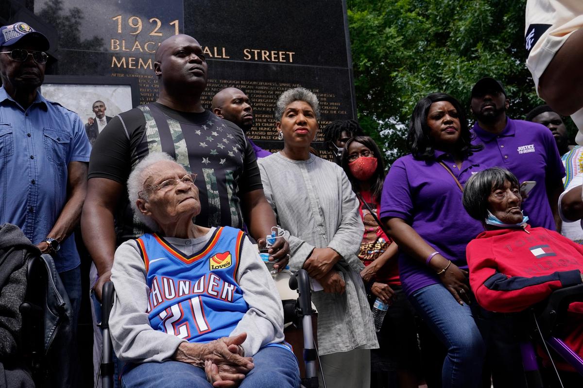 Tulsa race massacre survivors Viola Fletcher, left, and Lessie Benningfield Randle, right, listen during a rally marking centennial commemorations of a two-day assault by armed white men on Tulsa's prosperous Black community of Greenwood, in Tulsa, Oklahoma AP Photo/Sue Ogrocki
