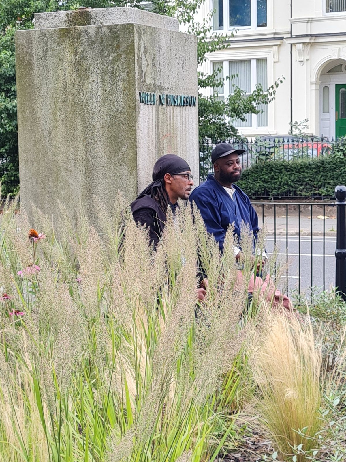 Harold Offeh (right) with his sound installation at the plinth of the toppled statue of William Huskisson Courtesy Twitter / Sonia Bassey