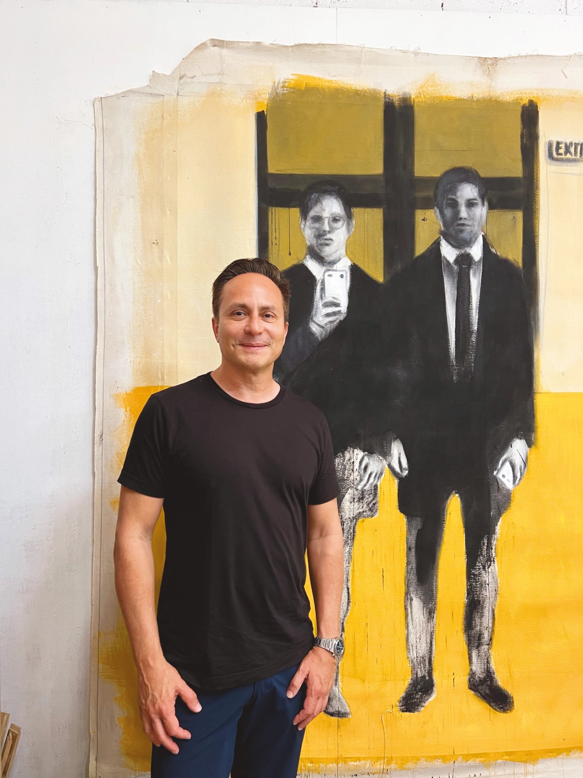 Mario Calder-Frech with a painting by Antonio Romero Courtesy of Mario Cader-Frech