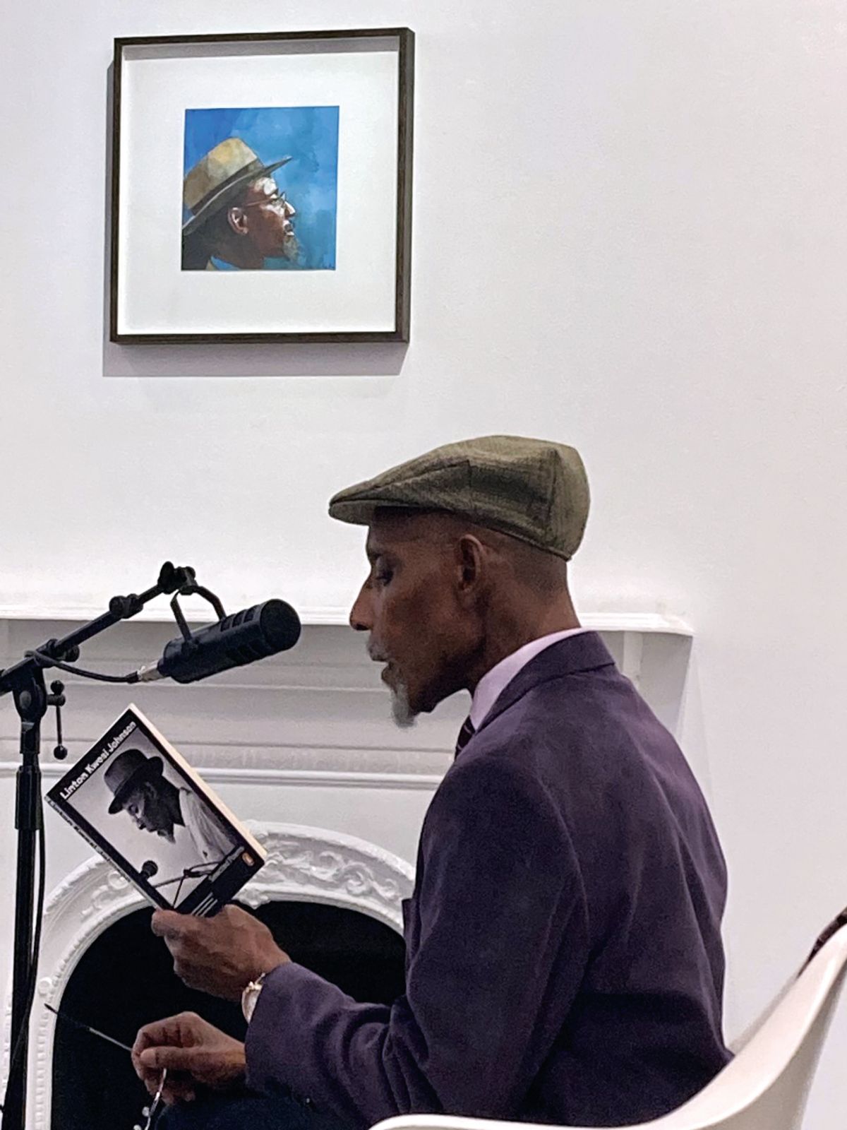 Kwesi Johnson reads one of his poems in front of Peter Blake’s portrait of him at Paul Stolper gallery in London

Photo: Sarah Hardacre