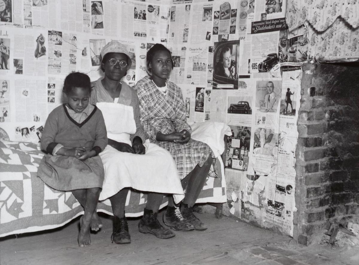 Gee's Bend artist Lucy Mooney and granddaughters Lucy P. Pettway and Bertha Pettway on a bed in Lucy’s house, Gee’s Bend, Alabama, 1937 Arthur Rothstein. Farm Security Administration/Office of War Information Collection, Prints and Photographs Division, Library of Congress.